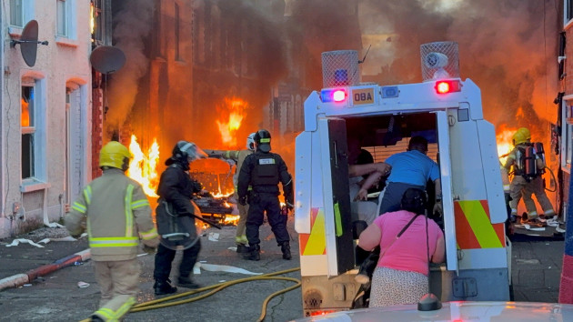 Bus set alight and buildings evacuated in Belfast as anti-immigration protests continue All bus and train services have been suspended, Translink said.